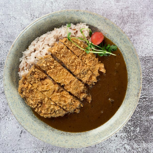 KEI's Japanese Katsu Curry with crispy pork cutlet, rice, and rich brown curry sauce.